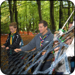 Bear Grylls encouraging Cubs on Unit assault course